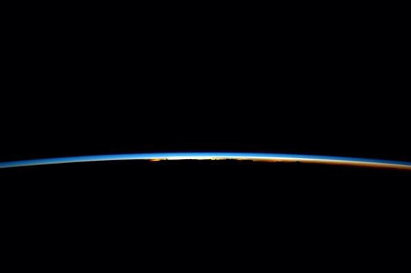 Distant storms at dawn iss+ Reid June 2014.jpg